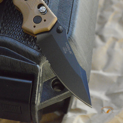 HK Exemplar Manual Folder: 3.25" Clip Point Blade (Partially Serrated) - Black Cerakote Finish, FDE G10 Frame